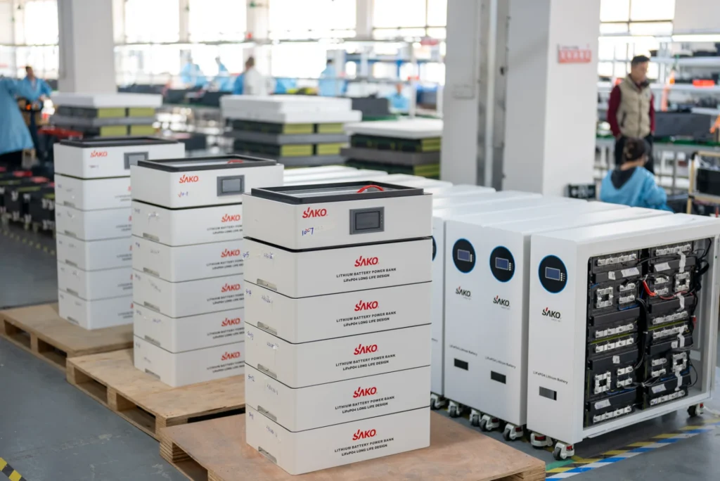 SAKO lithium battery power banks and energy storage systems in production at Tedepe factory with workers assembling products.