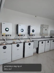 SAKO solar inverters mounted on wall above SAKO lithium energy storage batteries in a neat configuration indoors.